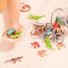 Bote con 60 piezas de reptiles